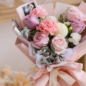 Purple rose, pink rose, pink carnation, white ping pong hand bouquet