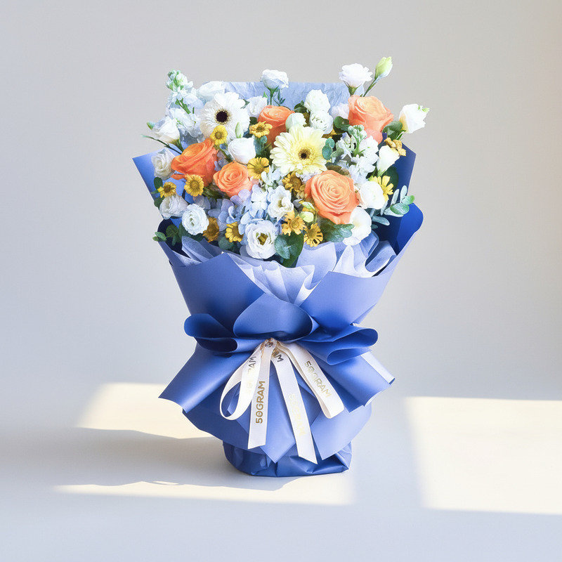 Blue Ember Orange Roses Hand Bouquet