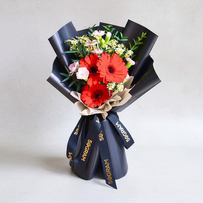 Red Wink Red Daisy Hand Bouquet